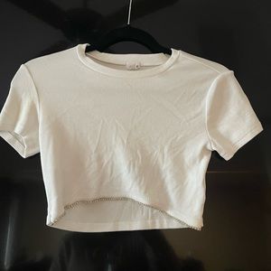 Cute going out tops with gems on the bottom. Fits crop top